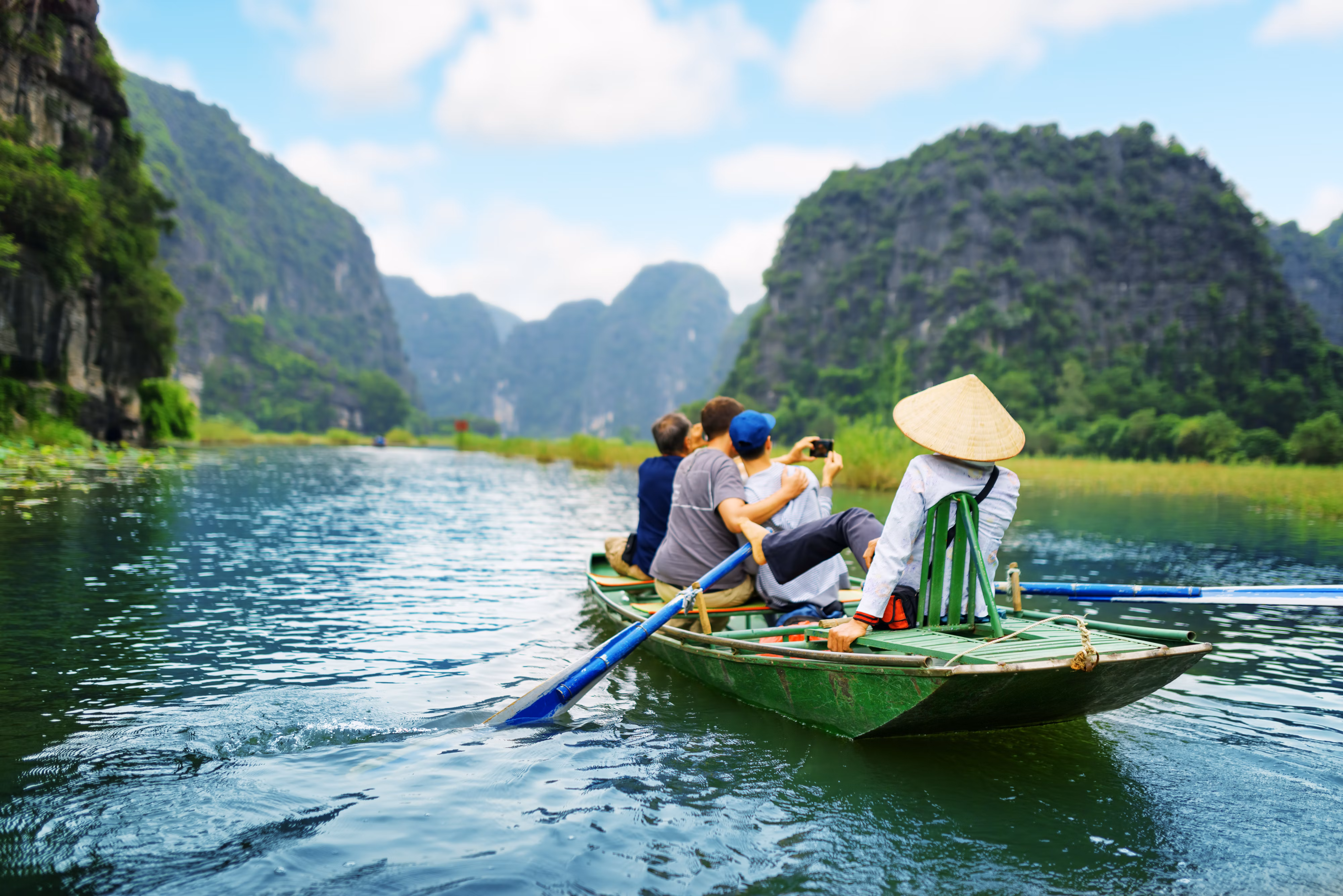 tourists in rowboat on river