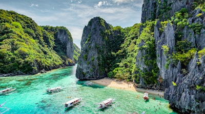 beach and cliffside in El Nido, Palawan, Philippines