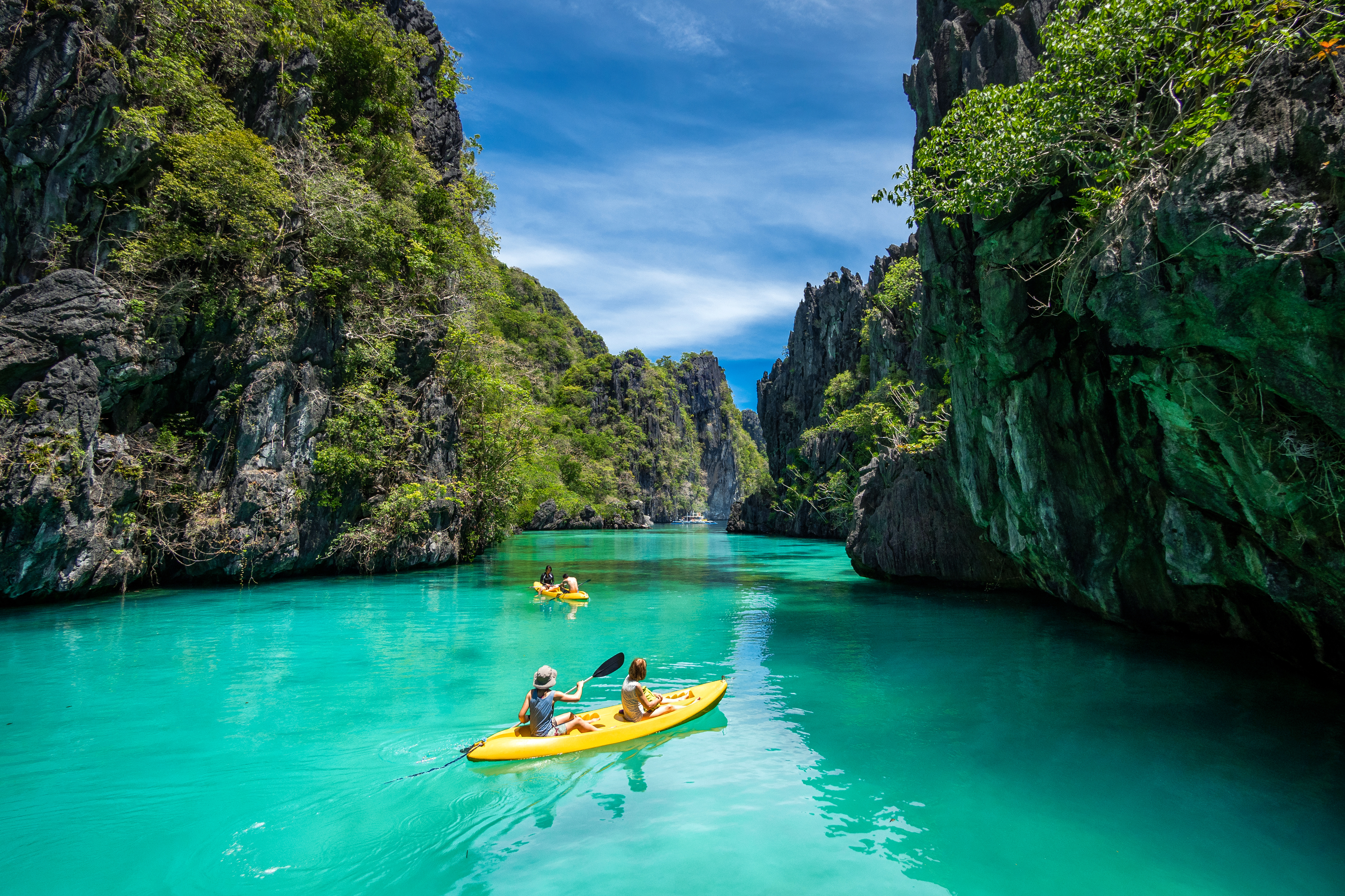 tourists kayaking in Palawan, Philippines