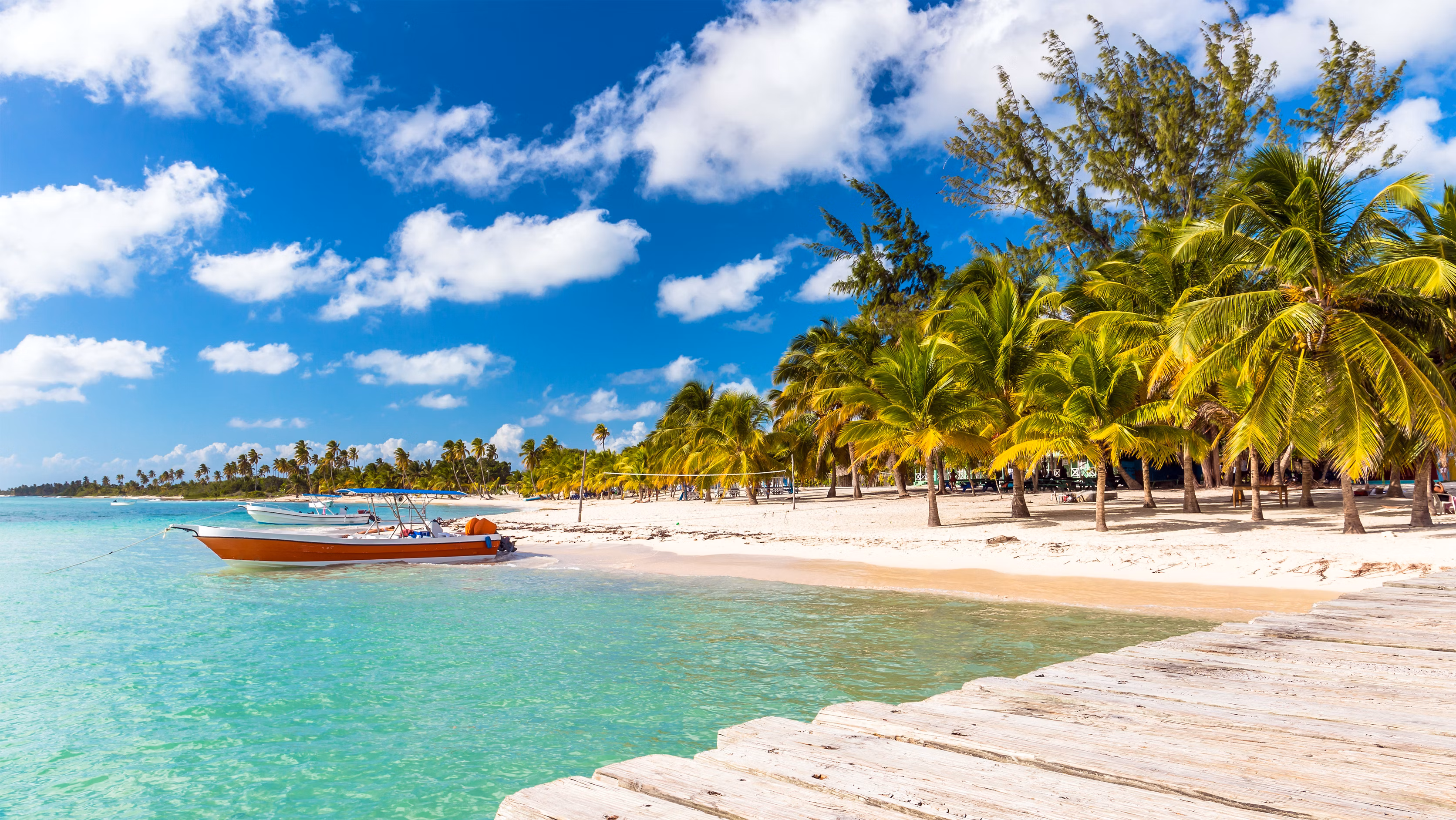 boats anchored at beach in Punta Cana