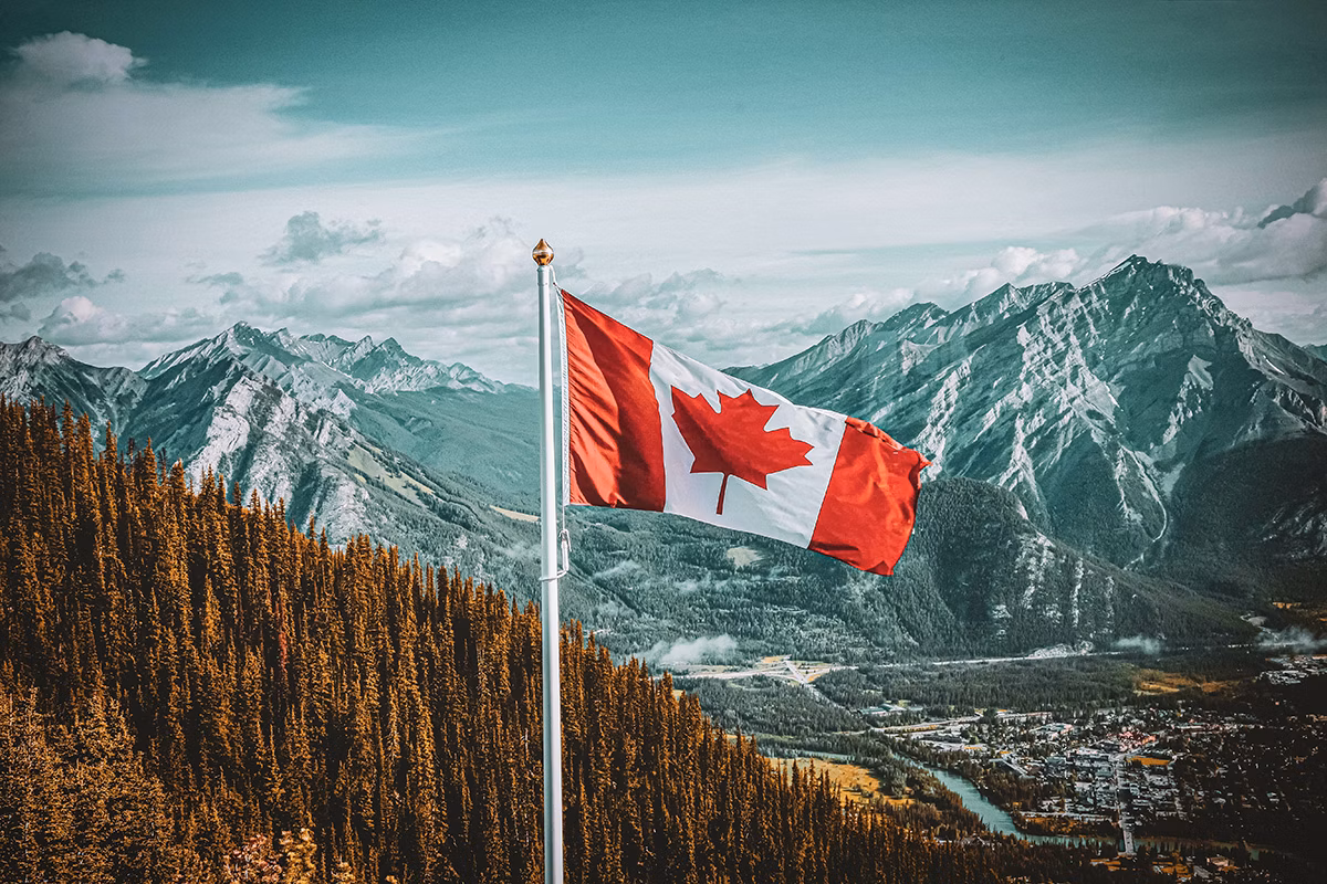 Canadian flag over landscape