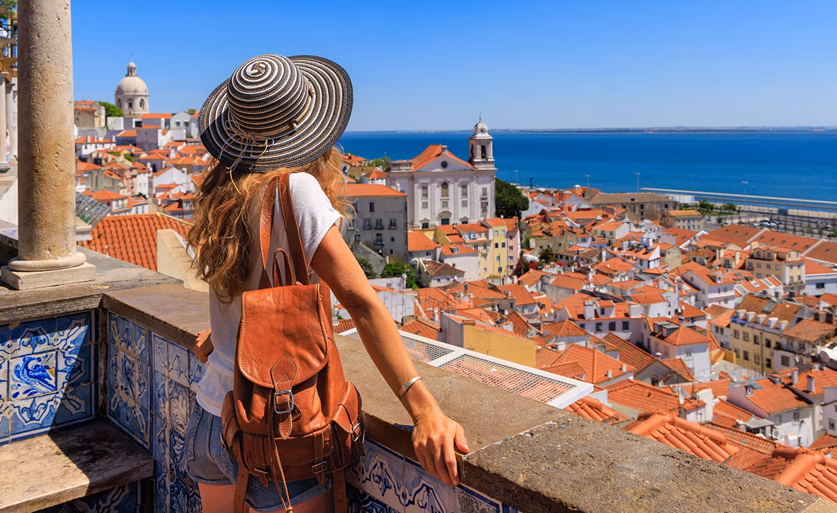 Woman enjoying view of Lisbon, Portugal
