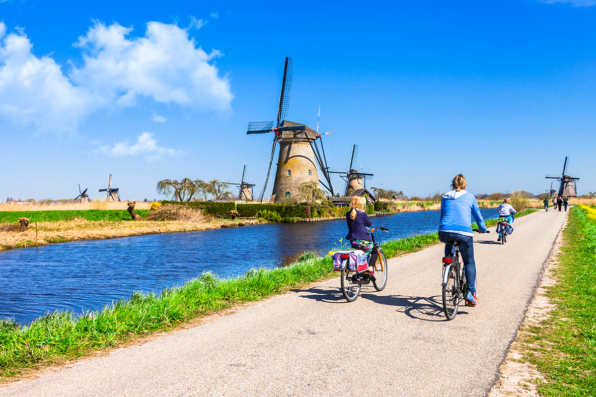 Bike path by historic Netherlands windmills
